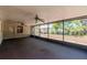 Enclosed sunroom with sliding glass windows, ceiling fans and outdoor views at 4425 W Bay Villa Ave, Tampa, FL 33611