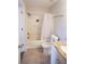 Cozy bathroom featuring a shower-tub combo and granite countertop vanity at 455 Alt 19 S # 235, Palm Harbor, FL 34683