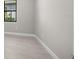 Bedroom with light wood-look tile floors and neutral paint at 4576 Blue Star Ct, North Port, FL 34289