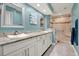 Elegant bathroom with dual sinks, granite countertops, and a spacious glass-enclosed shower at 50 Balsam Dr, Oldsmar, FL 34677