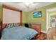 Comfortable bedroom featuring a Murphy bed, built-in desk and lots of natural light at 50 Balsam Dr, Oldsmar, FL 34677