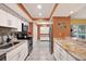 Updated kitchen features granite countertops, stainless steel appliances and white cabinets at 50 Balsam Dr, Oldsmar, FL 34677