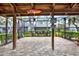 Enclosed patio area with brick flooring and outdoor decorations, perfect for relaxation at 50 Balsam Dr, Oldsmar, FL 34677