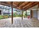Spacious covered patio with a patterned brick floor perfect for outdoor entertaining and relaxation at 50 Balsam Dr, Oldsmar, FL 34677