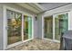 Back patio area with access to the home through sliding glass doors at 50 Balsam Dr, Oldsmar, FL 34677