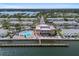 Expansive aerial view of a waterfront property showcasing a swimming pool and docks at 5174 Beach Se Dr # B, St Petersburg, FL 33705