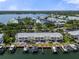 Waterfront condos with boat docks and lifts, overlooking a picturesque waterway and lush green surroundings at 5174 Beach Se Dr # B, St Petersburg, FL 33705