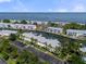 Breathtaking aerial view of waterfront condos, boat docks, canal, and Tampa Bay in the distance at 5174 Beach Se Dr # B, St Petersburg, FL 33705