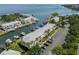 Scenic aerial view of waterfront condos with boat docks, canal, bay, and ample parking at 5174 Beach Se Dr # B, St Petersburg, FL 33705
