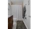 The bathroom features a vanity with a dark countertop, a toilet and a shower with a neutral-toned curtain at 5174 Beach Se Dr # B, St Petersburg, FL 33705