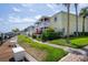 Beautifully maintained yellow condos with lush landscaping and waterfront views at 5174 Beach Se Dr # B, St Petersburg, FL 33705