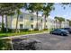 Well-maintained property exterior with ample parking and lush landscaping surrounding the building at 5174 Beach Se Dr # B, St Petersburg, FL 33705