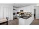 Updated kitchen boasting granite counters, stainless appliances, and sleek white cabinetry at 5174 Beach Se Dr # B, St Petersburg, FL 33705