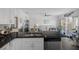 Open-concept kitchen with granite counters, stainless appliances, and view of the living area at 5174 Beach Se Dr # B, St Petersburg, FL 33705