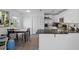 Modern kitchen with granite countertops, stainless steel appliances, and adjacent dining area at 5174 Beach Se Dr # B, St Petersburg, FL 33705