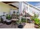 Inviting patio with comfortable seating, umbrella, and lush plants, perfect for relaxation at 5174 Beach Se Dr # B, St Petersburg, FL 33705