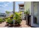 Charming outdoor patio with brick pavers and a variety of potted plants and flowers at 5174 Beach Se Dr # B, St Petersburg, FL 33705