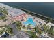 Aerial view of a stunning community pool with ample seating and waterfront access at 5174 Beach Se Dr # B, St Petersburg, FL 33705