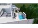 Aerial perspective of the outdoor space includes a pool with waterfall feature and a cozy fire pit area at 519 W Davis Blvd, Tampa, FL 33606
