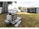 Grill and expansive backyard, perfect for entertaining and outdoor activities at 551 84Th N Ave, St Petersburg, FL 33702