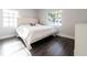 Clean bedroom with ample sunlight and modern wood-look flooring at 551 84Th N Ave, St Petersburg, FL 33702