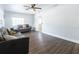 Spacious living room with hardwood floors and multiple seating areas at 551 84Th N Ave, St Petersburg, FL 33702