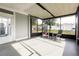Relaxing screened-in porch with seating and a view of the backyard at 551 84Th N Ave, St Petersburg, FL 33702