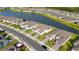 A scenic aerial view of the neighborhood with ponds and well-maintained landscaping on a sunny day at 5735 Mezzana Run, Palmetto, FL 34221