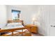 Inviting bedroom with natural light showcasing a comfortable bed and functional furniture at 5735 Mezzana Run, Palmetto, FL 34221