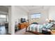 Bright bedroom features a cozy bed, window with natural light, and stylish furnishings at 5735 Mezzana Run, Palmetto, FL 34221