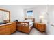 Bright bedroom boasts a comfortable bed, wooden furniture, and a serene atmosphere at 5735 Mezzana Run, Palmetto, FL 34221