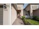 Charming front porch with stone accents, featuring two inviting rocking chairs and a wreath at 5735 Mezzana Run, Palmetto, FL 34221