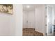 Bright hallway with modern vinyl flooring and multiple closets for ample storage at 5735 Mezzana Run, Palmetto, FL 34221