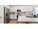 Bright, modern kitchen features stainless steel appliances, white cabinets, and a spacious countertop at 5735 Mezzana Run, Palmetto, FL 34221