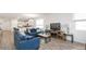 Open concept living space with seamless integration of the kitchen, dining, and living room at 5735 Mezzana Run, Palmetto, FL 34221
