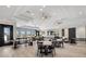 Inviting lounge space featuring comfortable seating, contemporary design, and lots of room to socialize at 7018 Ripple Pond Loop, Zephyrhills, FL 33541