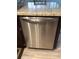 Close-up of a stainless steel dishwasher, part of a modern kitchen appliance package at 7321 Isle Dr, Port Richey, FL 34668