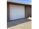 Close-up of a clean, white two-car garage door with house number at 7321 Isle Dr, Port Richey, FL 34668