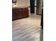 Kitchen area displaying custom cabinetry, stainless steel appliances, and durable tile flooring at 7321 Isle Dr, Port Richey, FL 34668