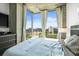 Well-lit bedroom with floor to ceiling windows offering scenic park view at 777 N Ashley Dr # 402, Tampa, FL 33602