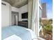 Bedroom view showcasing the city skyline through expansive windows at 777 N Ashley Dr # 402, Tampa, FL 33602