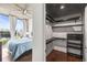 Bedroom includes closet with sleek shelving and hardwood floors at 777 N Ashley Dr # 402, Tampa, FL 33602