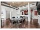 Open-concept dining area with a glass table and modern chairs at 777 N Ashley Dr # 402, Tampa, FL 33602