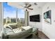 Modern living room with expansive windows offering city views and designer touches at 777 N Ashley Dr # 402, Tampa, FL 33602