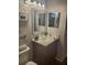 Stylish bathroom vanity features decorative mirror and modern fixtures at 7941 Clarendon Dr, New Port Richey, FL 34654