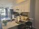 Eat-in kitchen featuring a breakfast bar with stools and stainless steel appliances at 7941 Clarendon Dr, New Port Richey, FL 34654