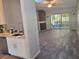 Open floor plan with modern flooring and fireplace at 7941 Clarendon Dr, New Port Richey, FL 34654