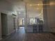 Open concept with view of kitchen, with French doors leading to the front of the house at 7941 Clarendon Dr, New Port Richey, FL 34654