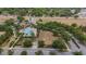 Aerial view of a community pool with lounge chairs, landscaping, and a playground at 803 Floresta St, Brandon, FL 33511