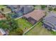 Aerial view of a home with a screened patio, a fenced yard, and a play set at 803 Floresta St, Brandon, FL 33511